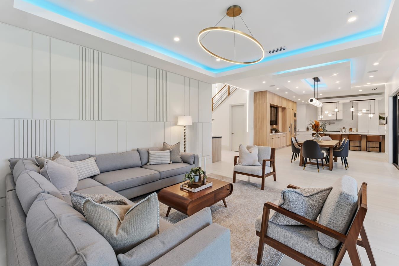 Great room with sectional and open view to the kitchen and dining